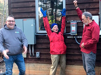 A Virginia homeowner celebrates after installing solar panels